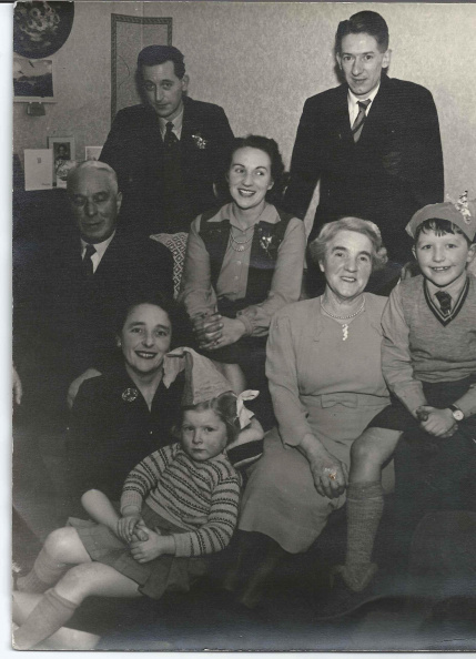 Jos b_1922 _back right__amp_ Ann Dawson _front_ 1st xmas back in Heywood at Mrs White_s house.jpeg